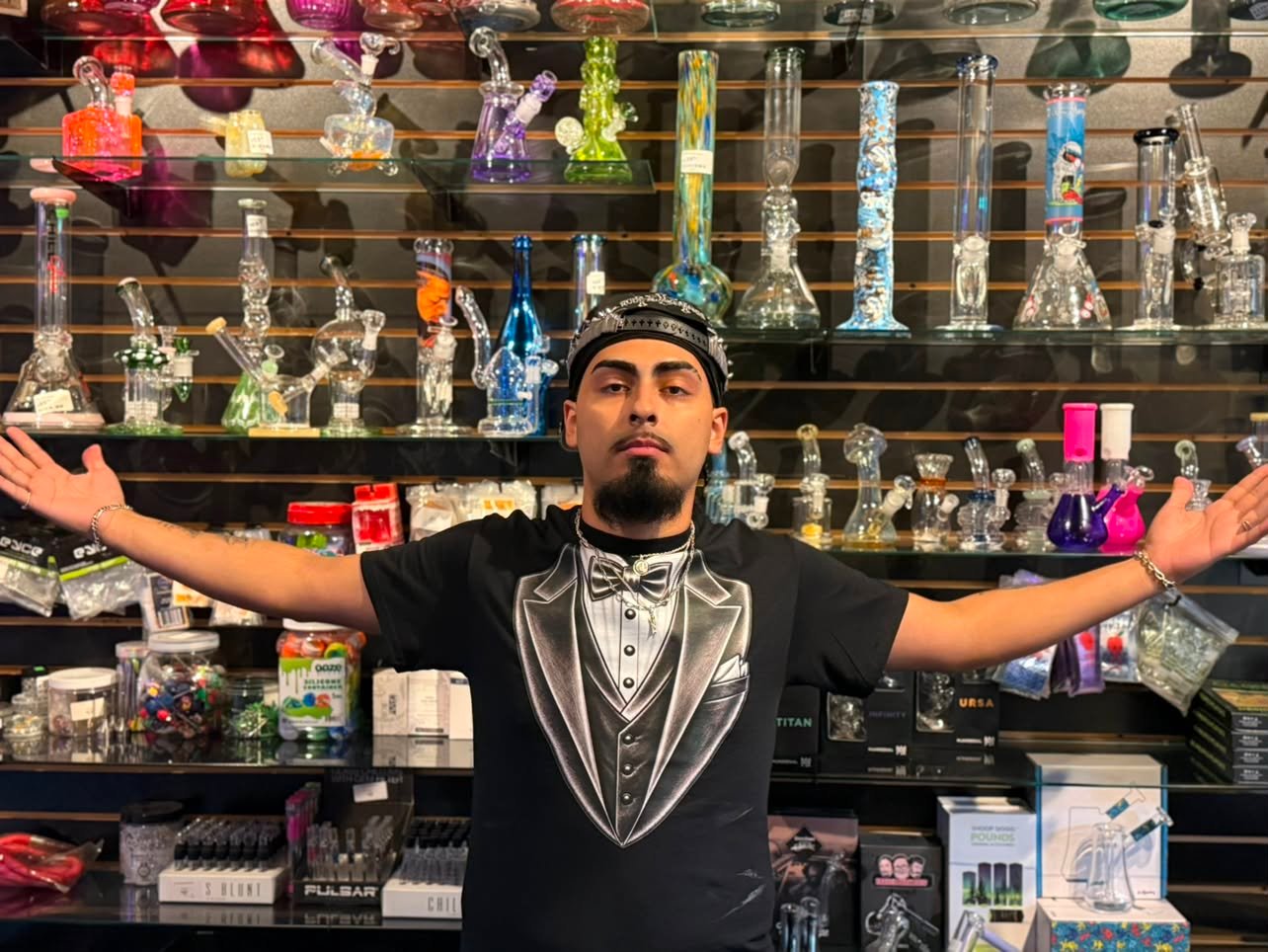 Mr. Nice Guy staff showing off the merch